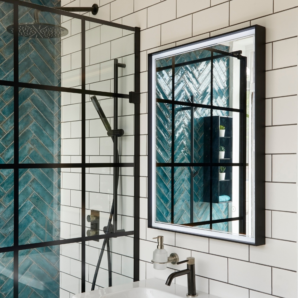 Product Lifestyle image of Origins Living Astoria 600mm x 800mm Black Mirror next to a shower enclosure. B008356